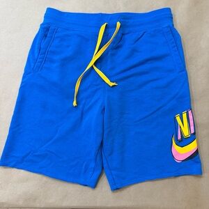 Nike Blue Athletic Shorts with Yellow Accents